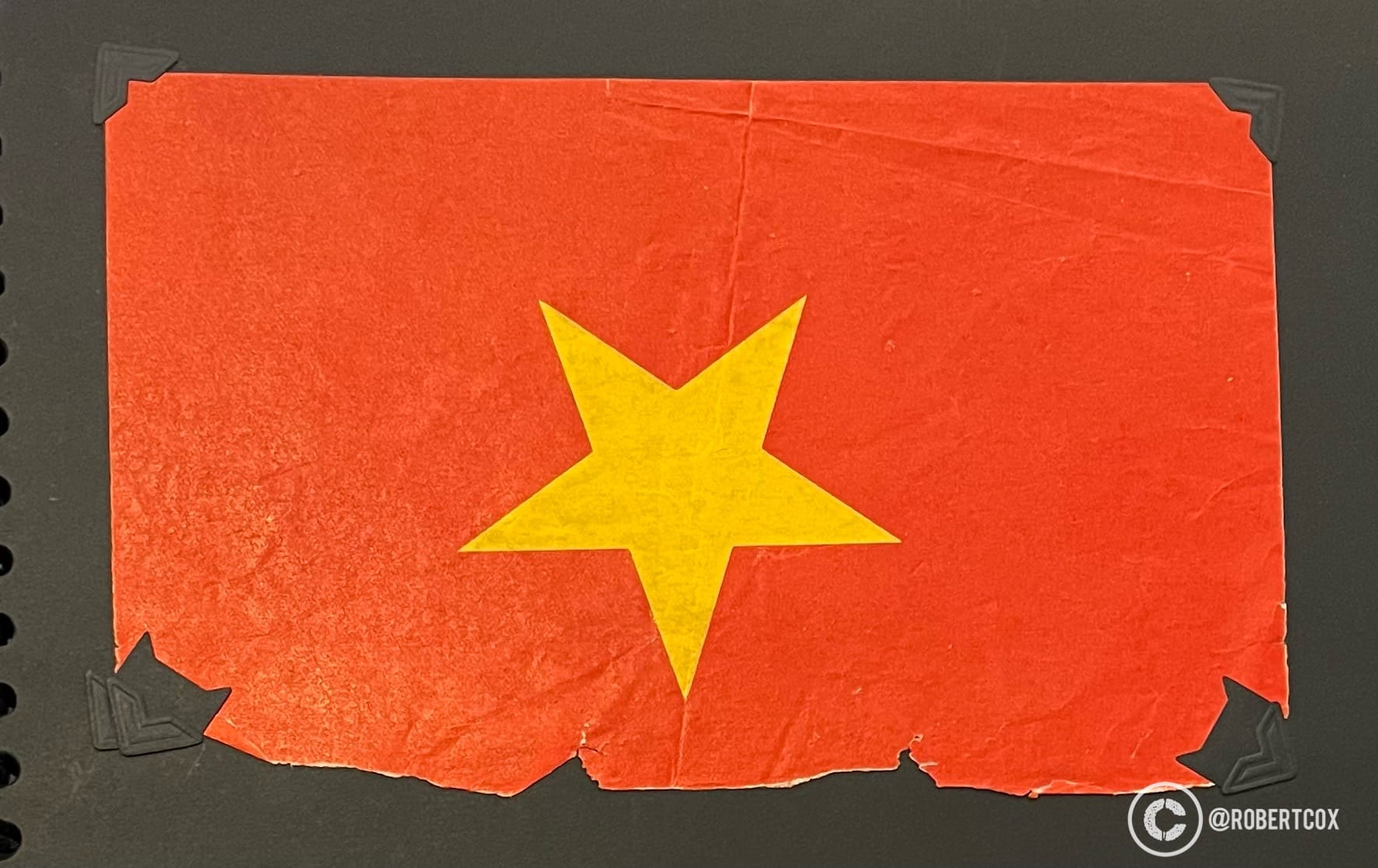 I was offered this paper Vietnamese flag by a young man during the parade rehearsals in Saigon on April 28, 1995.