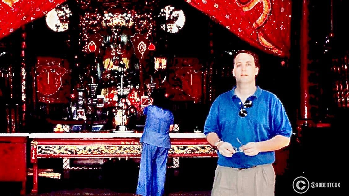 I visited the Thiên Hậu Pagoda (Chùa Bà Thiên Hậu) in Saigon on Saturday, April 29, 1995 The ornate altar, adorned with red and gold decorations, offerings, and intricate carvings, is dedicated to Thiên Hậu, the Chinese sea goddess. The setting reflects traditional Chinese-Vietnamese religious practices, with elements like incense burners and ceremonial items visible on the altar.